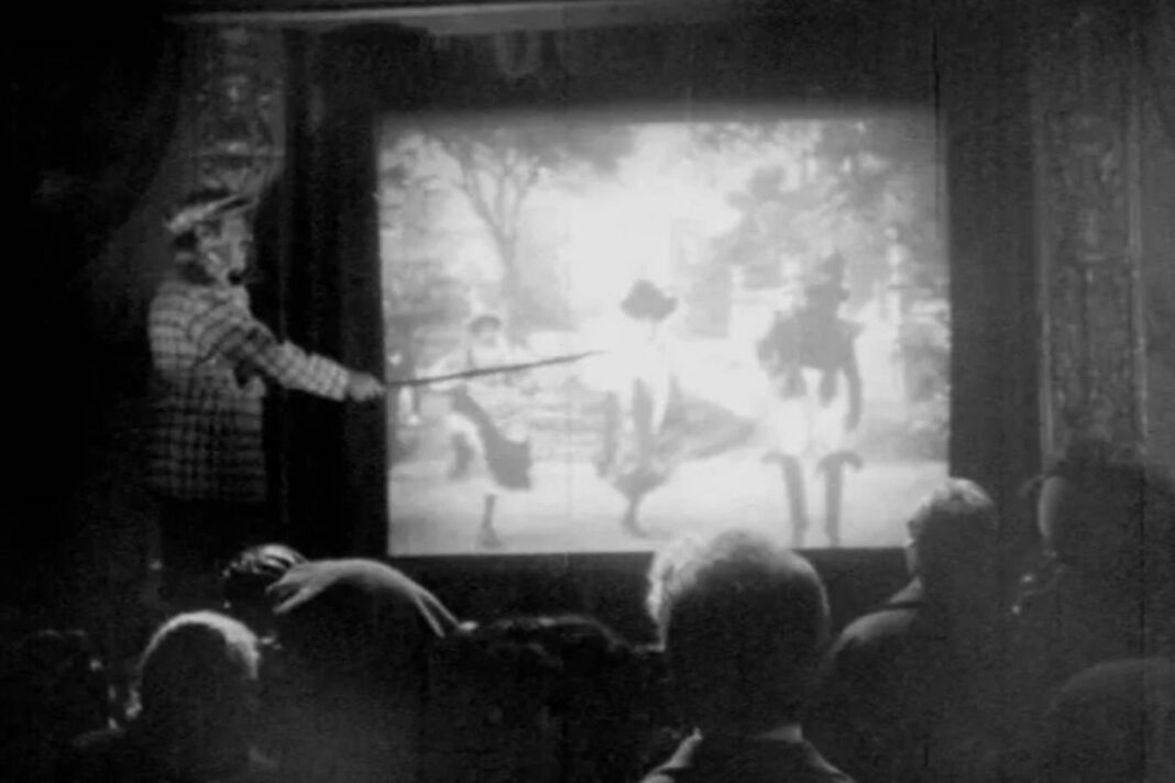 Ilustración de un explicador de cine mudo señalando la pantalla con un puntero
